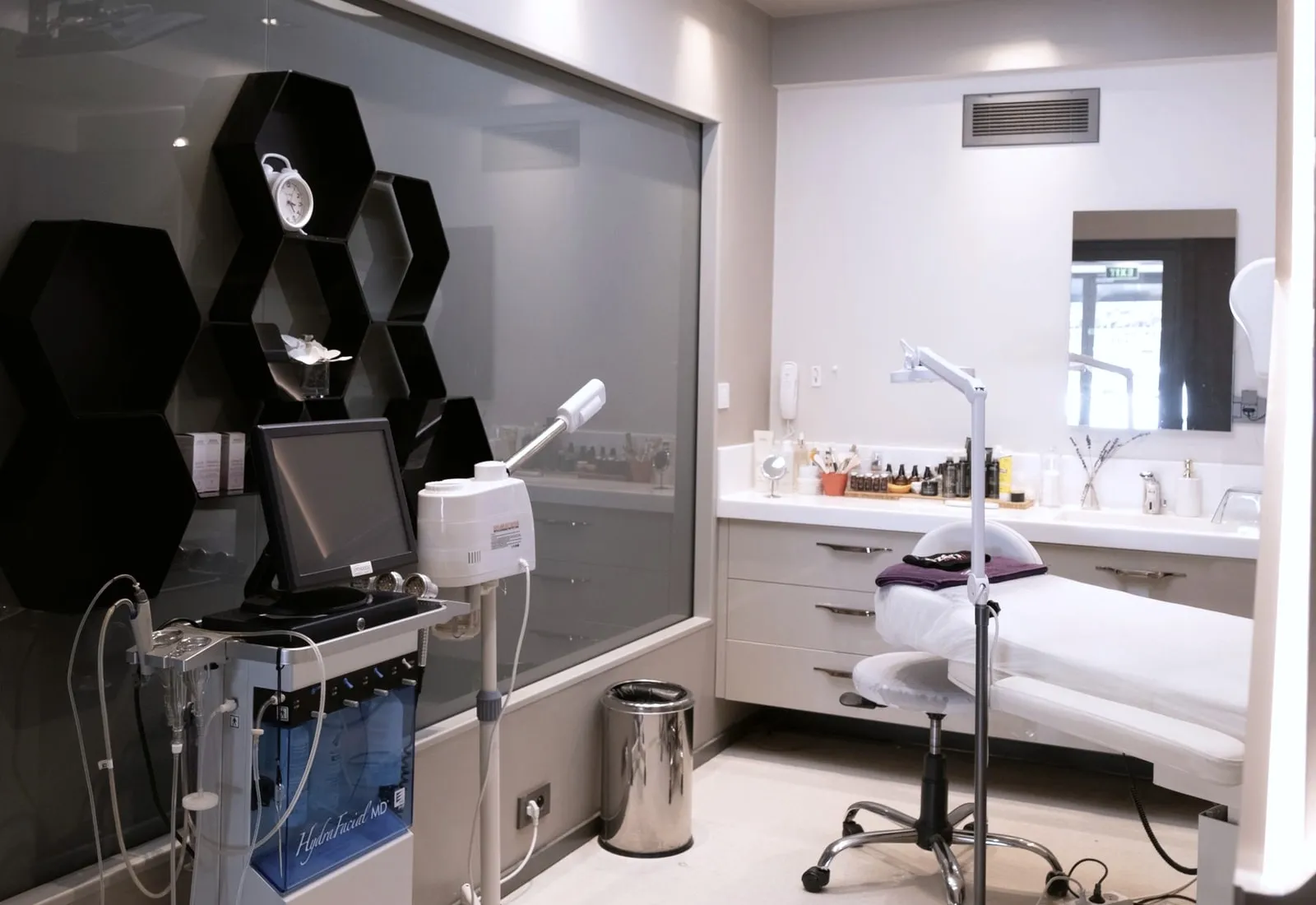 The treatment room, couch made up and the hydradermabrasion unit beside it.